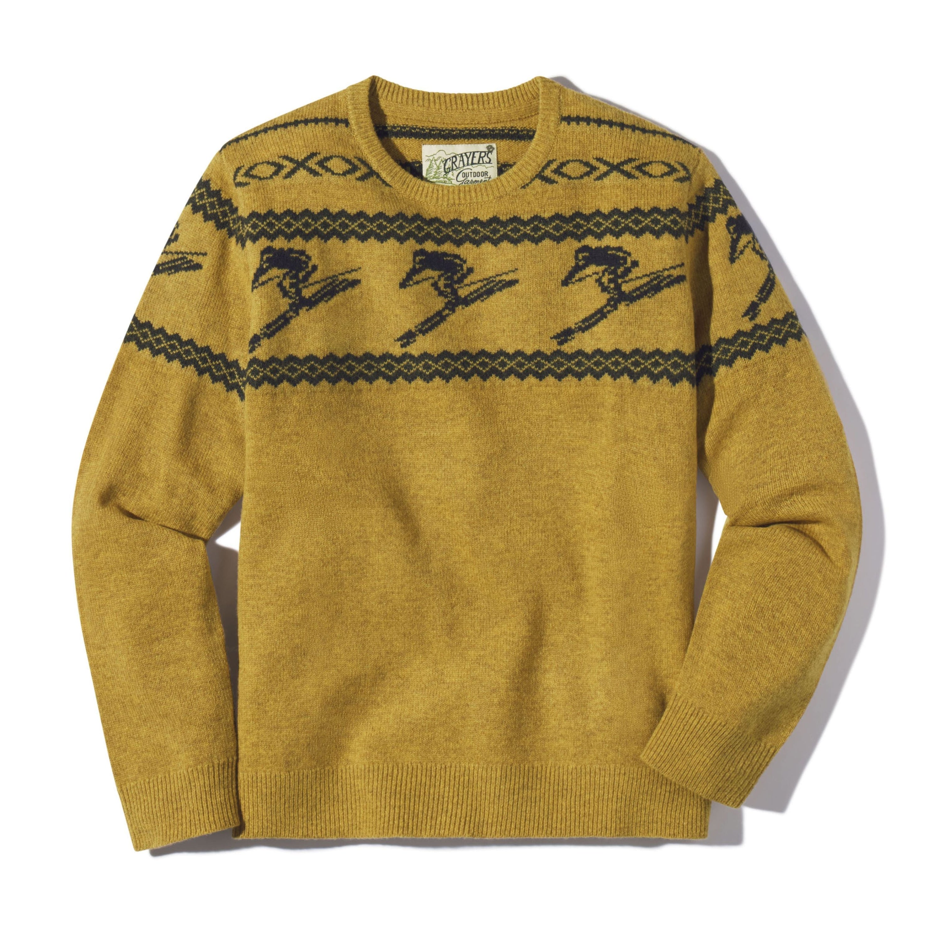 Mustard yellow sweater with black pattern on a white background