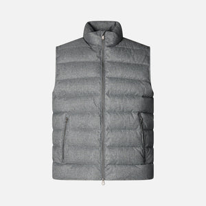 Gray puffer vest on a beige background