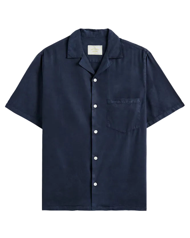 Navy short-sleeve shirt with button details on a beige background