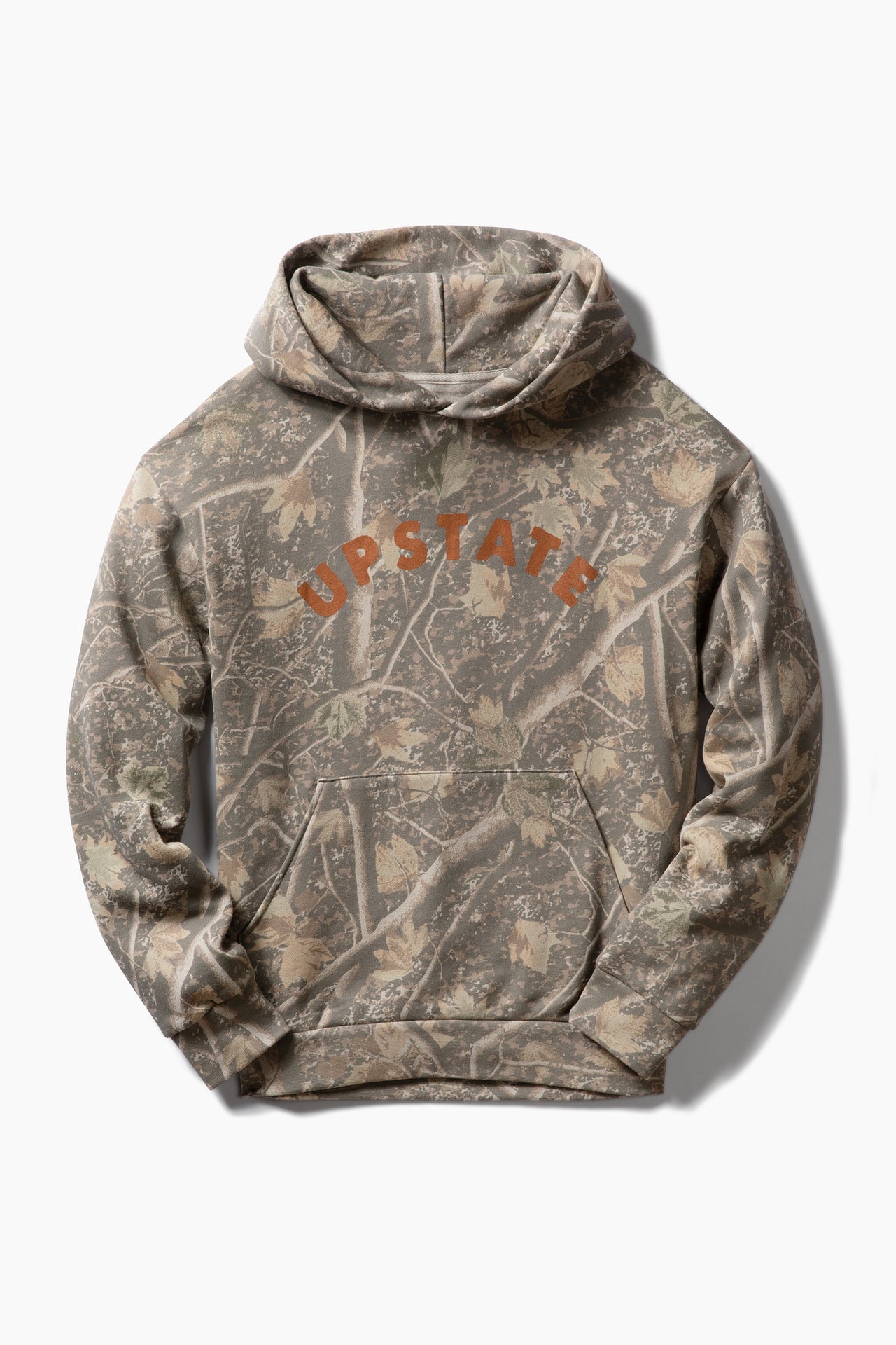 A camouflage hoodie featuring a woodland tree-bark pattern in shades of brown, beige, and gray, with the word 'UPSTATE' printed in orange arched across the chest.