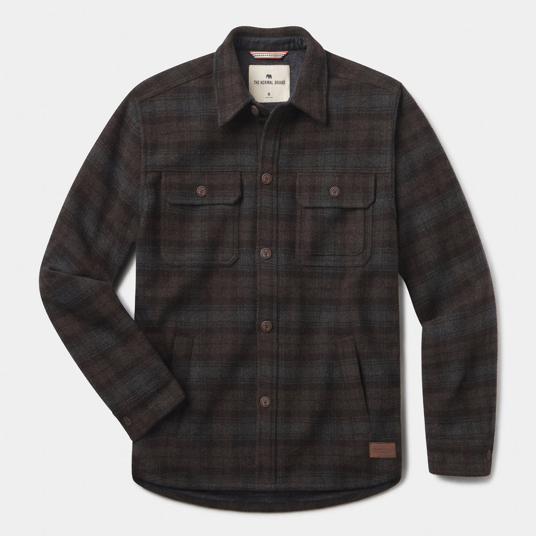 Plaid shirt with button details on a light gray background