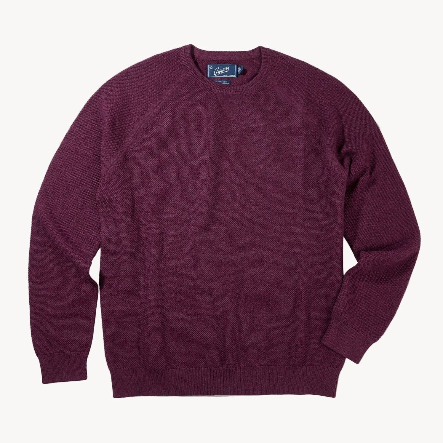 Maroon sweater on a white background