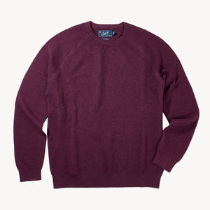 Maroon sweater on a white background