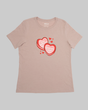 Beige t-shirt with red heart-shaped candy graphic and text on a white background