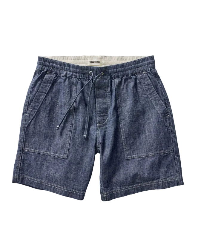 Blue denim shorts with drawstring on a white background